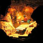 Researchers work in the Tunnel of Bones cave where 12 Neanderthal specimens dating to around 49,000 years ago were recovered. (Antonio Rosas)