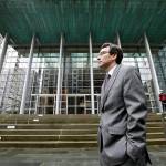 Attorney General Bob Ferguson stands on the steps of the federal courthouse March 15 in Seattle. (Elaine Thompson / AP file)