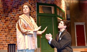 Arlington High School                                Nathan Detroit (Curtis Welch) begs for forgiveness from his long-time fiancé Miss Adelaide (Madison Schimpf) in Arlington High School&rsquo;s production of &ldquo;Guys and Dolls.&rdquo;