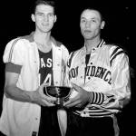 Jerry West (left) of West Virginia and Lenny Wilkens of Providence, members of the East team, hold the trophy awarded to them for being named Most Valuable Players of the East-West All-Star basketball game at New York&rsquo;s Madison Square Garden on March 26, 1960. Wilkens dropped in the winning basket with three seconds left to play. (Associated Press photo)
