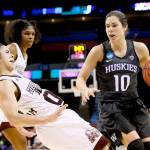 Washington guard Kelsey Plum (10) drives past Mississippi State guard Dominique Dillingham during the second half of a regional semifinal of the NCAA women&rsquo;s college basketball tournament on Friday in Oklahoma City. (AP Photo/Sue Ogrocki)