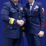Rear Adm. Mark Butt, commander of the Coast Guard 13th District, shakes hands with Petty Officer 1st Class Nicole Cimino, a reserve gunner&rsquo;s mate assigned to the Coast Guard Port Security Unit 313 in Everett, after she was announced as the Reserve Enlisted Person of the Year at a ceremony held March 3, 2017 at Coast Guard Base Seattle. (U.S. Coast Guard photo by Petty Office 3rd Class Amanda Norcross)