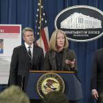 Acting Assistant Attorney General Mary McCord (center), accompanied by U.S. Attorney for the Northern District Brian Stretch (left) and FBI Executive Director Paul Abbate, speaks during a news conference at the Justice Department in Washington on Wednesday, March 15. (AP Photo/Susan Walsh)