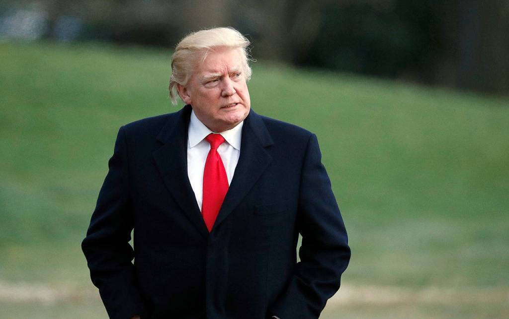 Returning from a trip to his Mar-a-Lago estate in Palm Beach, Florida, President Donald Trump walks to the White House after arriving on Marine One on Sunday. (AP Photo/Alex Brandon)