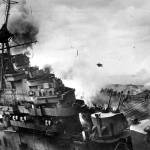 An explosion rocks the USS Franklin after the warship was hit by two 500 pound armor-piercing bombs from a Japanese dive bomber on March 19, 1945, off the coast of Honshu, during the Okinawa invasion. The attack killed 724 people, but the ship was saved. (Associated Press photo)