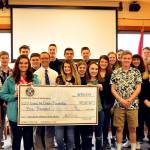 Snohomish High School students accept a $5,000 donation from the Snohomish Kiwanis Club for a Fight Against Hunger fundraiser. (Contributed photo)