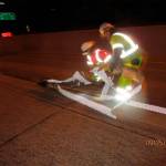 Washington State Department of Transportation crews remove temporary striping through a September 2015 night along a 10-mile stretch of I-405. WSDOT will keep using temporary striping until the Legislature&rsquo;s two-year review of the I-405 express toll lanes. (WSDOT photo)