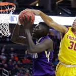 Washington&rsquo;s Malik Dime (left) shoots next to Southern California&rsquo;s Elijah Stewart during the first half of a game in the first round of the Pac-12 men&rsquo;s tournament March 8, 2017, in Las Vegas. (AP Photo/John Locher)