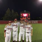 Washington State pitchers (from left) Scotty Sunitsch, Marysville Pilchuck alum Cody Anderson, Joe Rosenstein and Isaac Mullins pose in front of the scoreboard after combining to throw a no-hitter against Stephen F. Austin on March 5, 2017, in Pullman. (Washington State Athletics)