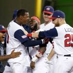 The United States&rsquo; Adam Jones (10) celebrates with Josh Harrison (center) and Jonathan Lucroy (25) after hitting a game-winning RBI single to score Christian Yelich during the 10th inning against Colombia in a first-round game of the World Baseball Classic on March 10, 2017, in Miami. (AP Photo/Lynne Sladky)