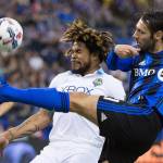 The Impact&rsquo;s Matteo Mancosu (right) challenges the Sounders&rsquo; Roman Torres during the first half of an MLS match on March 11, 2017 in Montreal. (Graham Hughes/The Canadian Press via AP)