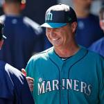 Mariners manager Scott Servais smiles as he talks to a coach prior to a spring training game against the Cubs on March 10, 2017, in Peoria, Ariz. (AP Photo/Ross D. Franklin)