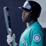 The Mariners&rsquo; Guillermo Heredia waits in the dugout for his turn to bat during the third inning of a spring training game against the Padres on Feb. 26, 2017, in Peoria, Ariz. (AP Photo/Charlie Riedel)