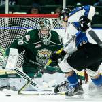 Silvertips goalie Carter Hart (70) eyes the puck as Kootenay&rsquo;s Zak Zborosky skates in front of the net during a game Nov. 30, 2016, at Xfinity Arena in Everett. (Ian Terry / The Herald)