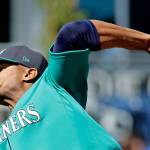 Mariners starting pitcher Ariel Miranda throws during the first inning of a spring training game against the Brewers on March 2, 2017, in Peoria, Ariz. (AP Photo/Charlie Riedel)