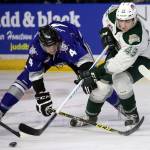 Victoria&rsquo;s Ralph Jarratt (left) and Everett&rsquo;s Connor Dewar battle for the puck during a playoff game on March 25, 2017, at Xfinity Arena in Everett. (Kevin Clark / The Herald)