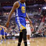 Nick Wass / Associated Press                                Golden State Warriors forward Kevin Durant (35) walks to the bench after hyperextending his left knee Tuesday during the first quarter of an NBA game against the Washington Wizards. Durant did not return to the game.