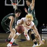 Stanwood&rsquo;s AJ Martinka attempts to split the defensive pressure of Shorecrest&rsquo;s Chris Lee (left) and Malcolm Rosier-Butler during a 3A Hardwood Classic tournament game March 1 at the Tacoma Dome. Stanwood defeated Shorecrest 64-52. (Kevin Clark / The Herald)
