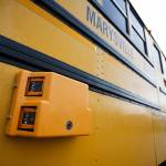 A still camera is affixed to the driver&rsquo;s side of a Marysville school bus. The still camera captures license plates of cars who pass the bus illegally, while a video camera near the rear records a wide view of the scene. (Ian Terry / The Herald)