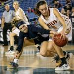 Glacier Peak&rsquo;s Paisley Johnson tries to steal the ball away from Moses Lake&rsquo;s Jamie Loera during a 4A state tournament semifinal game on March 3, 2017, at the Tacoma Dome. Glacier Peak won 55-51 to advance to the state finals. (Kevin Clark / The Herald)