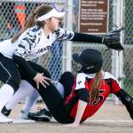 Snohomish&rsquo;s Rylie Wales beats a throw to Jackson&rsquo;s Kassidi Dean at third base during a game on March 16, 2017, at Valley View Middle School in Snohomish. Jackson won 3-1. (Kevin Clark / The Herald)