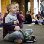 Allie Laplaunt and her 2-year-old son, Landon, listen to a story during Ready Readers: Toddler Storytime hosted by the Lake Stevens Library at the neighboring Community Center on Tuesday. The library utilizes the large space in the community center for events and readings. (Daniella Beccaria / The Herald)