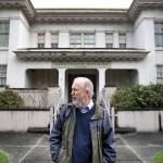 Jack O&rsquo;Donnell, chairman of the Everett Historical Commission, stands in front of the Longfellow building in December. (Andy Bronson / Herald file)