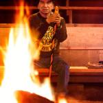 In the Tulalip Tribes&rsquo; sacred long house on Tulalip Bay in April 1999, Raymond Moses prepares a warm fire before meeting with youngsters from Pinewood Elementary School in Marysville. (Dan Bates / Herald file)