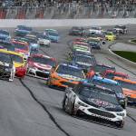 Kevin Harvick leads off the start during a NASCAR Monster Cup series auto race at Atlanta Motor Speedway in Hampton, Ga., Sunday, March 5. (AP Photo/John Amis)
