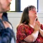 Chrissi Fisk sings during Sunday morning service. (Kevin Clark / The Herald)