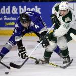 Victoria&rsquo;s Ralph Jarratt (left) and Everett&rsquo;s Connor Dewar chase down a loose puck in the second period of a playoff game on March 25, 2017, at Xfinity Arena in Everett. (Kevin Clark / The Herald)
