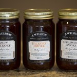 J. Wilbur Food&rsquo;s barbecue sauce varieties (from left) Spicy Hickory, Hickory Smoke and Applewood Smoke. (Ian Terry / The Herald)