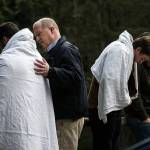 Lynnwood Police Chaplain Dale Schlack (center left) speaks with a friend of the girl. (Ian Terry / The Herald)