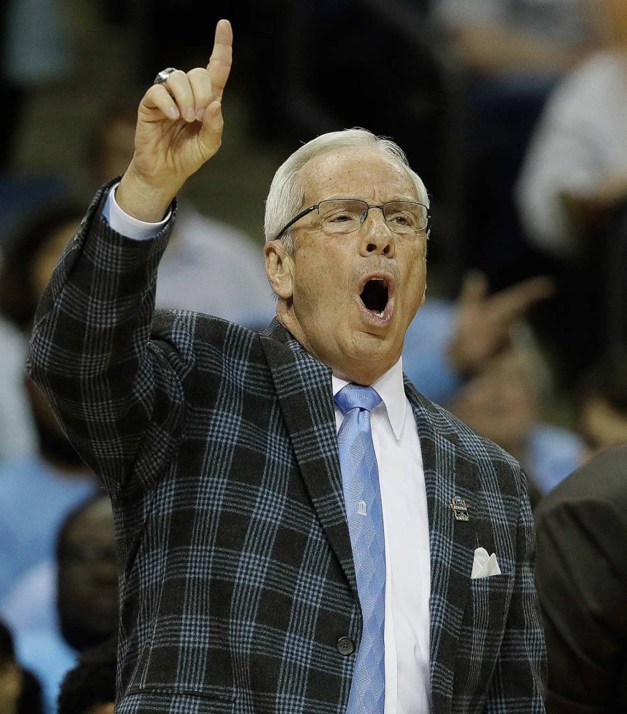 North Carolina head coach Roy Williams speaks to players in the first half of the South Regional final game against Kentucky in the NCAA college basketball tournament Sunday, March 26, in Memphis, Tenn. (AP Photo/Mark Humphrey)