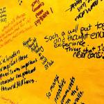 Viewers of the Tunnel of Intersections exhibit at Edmonds Community College Wednesday wrote their reactions on paper signs that display planners called a graffiti space. The exhibit, meant to highlight oppression, features the experiences of diverse groups. (Courtesy Edmonds Community College)