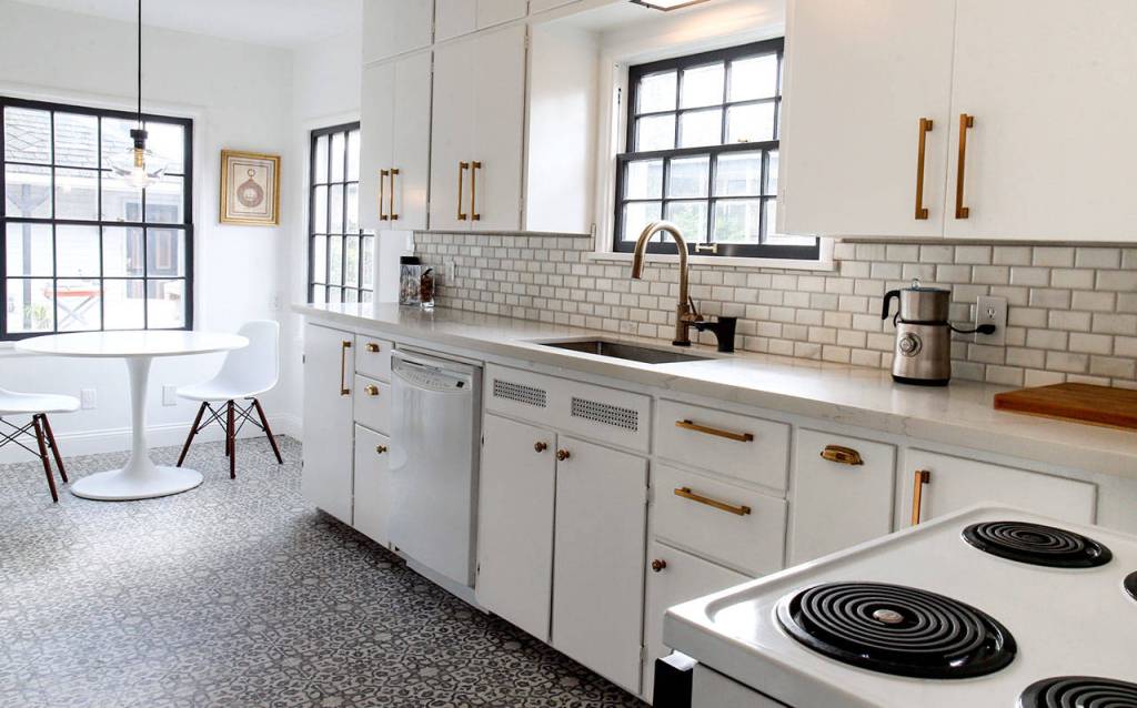 The Leonards&rsquo; kitchen features quartz countertops and a marble backsplash. Kippi Leonard designed and tiled the backsplash herself. (Kevin Clark / The Herald)