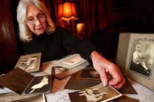 Everett&rsquo;s Lorna Donadio, 77, has been collecting old photos she finds at garage sales, some dating back as far as 1911. As time passes, she wants them to have a home. (Dan Bates / The Herald)
