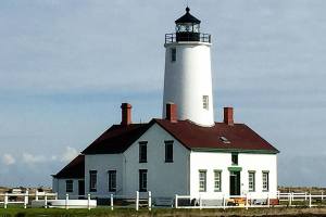The New Dungeness Light Station at the end of a 5-mile sand spit on the Strait of Juan de Fuca near Sequim is rented by the week. Guests do light lighthouse keeping duties such as leading tours, making journal entries and raising the flag. (Rose Erickson)