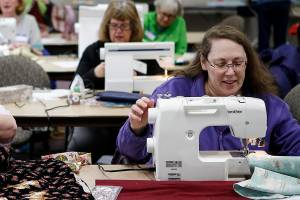 Volunteers gather to sew projects for various groups