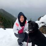 Rebecca Boehm, of Lake Stevens, pauses on Mount Si with her dog, Mylie, while training to climb Mount Rainier in June after she graduates from college. She is trying to raise $1,441, or 10 cents for every foot of the 14,410-foot elevation, for Compassion International. (Photo by Brian Boehm)