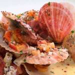 Elliott&rsquo;s Oyster House Singing Scallops in Champagne Cream Sauce (photo credit: Robert Spaulding / Elliott&rsquo;s Oyster House.)