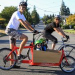 In this photo from last summer, Tyler and Brittney Rourke get ready to head out on a bike ride with sons Bryan and Reece. The family will help lead a tour of Everett&rsquo;s fire stations on Saturday. (Herald file photo by Kevin Clark)