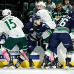 Everett&rsquo;s Sean Richards (left) and Bryce Kindopp (center right) get tangled up against the boards with Seattle&rsquo;s Sami Moilanen (center left) and Nolan Volcan (right) during a game on Oct. 15, 2016, at Xfinity Arena. (Ian Terry / The Herald)