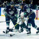 Silvertips right wing Patrick Bajkov (center) gets hit by Seattle&rsquo;s Aaron Hyman (right) and Keegan Kolesar during the first game of a second-round playoff series on April 7, 2017, at Xfinity Arena in Everett. (Ian Terry / The Herald)