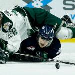 Silvertips right wing Devon Skoleski (28) battles for the puck with Seattle&rsquo;s Donovan Neuls (19) during the first game of their second-round playoff series on April 7, 2017, at Xfinity Arena in Everett. (Ian Terry / The Herald)
