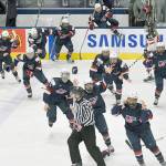 U.S. players celebrate after a 3-2 overtime win over Canada during the gold medal game of the women&rsquo;s hockey world championships on Friday in Plymouth, Michigan. (Jason Kryk/The Canadian Press via AP)