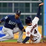 Houston Astros&rsquo; George Springer is tagged out by Seattle Mariners shortstop Jean Segura while attempting to steal second during the third inning of Tuesday&rsquo;s game in Houston. (AP Photo/Eric Christian Smith)