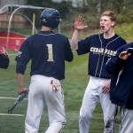 Cedar Park Christian&rsquo;s George Reidy (right) congratulates teammate Michael Attalah (center) after scoring during a game against Archbishop Murphy on April 11, 2017, at Archbishop Murphy High School in Everett. (Ian Terry / The Herald)