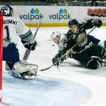 Silvertips right wing Riley Sutter (right) is brought down in front of the Thunderbirds&rsquo; net during Game 3 of a second-round playoff series on April 11, 2017, at the ShoWare Center in Kent. (Ian Terry / The Herald)