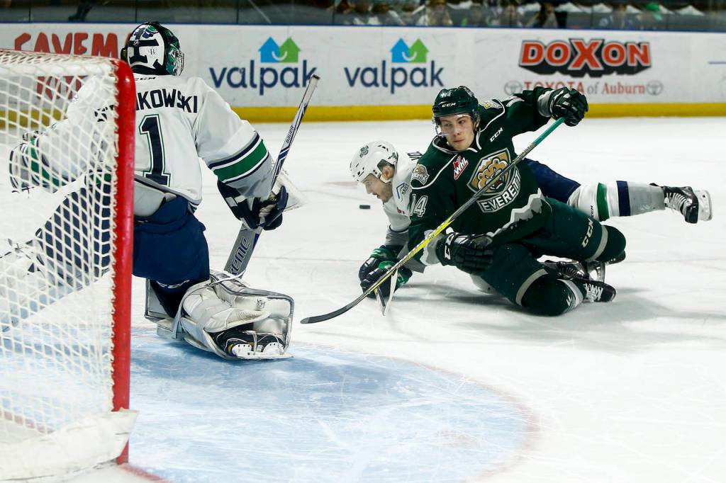 Silvertips right wing Riley Sutter (right) is brought down in front of the Thunderbirds&rsquo; net during Game 3 of a second-round playoff series on April 11, 2017, at the ShoWare Center in Kent. (Ian Terry / The Herald)